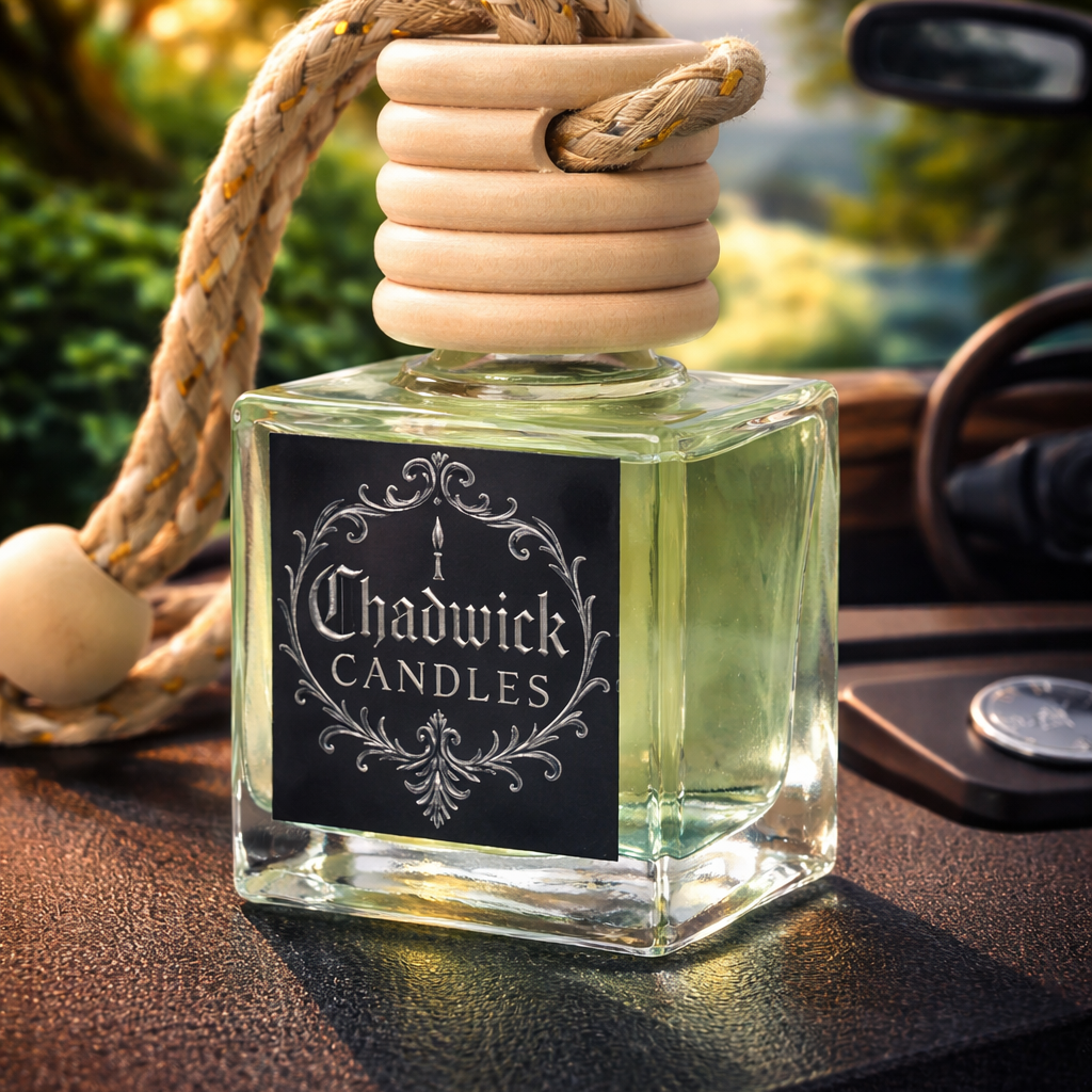 Chadwick Candles car air freshener on a car dashboard with a scenic background