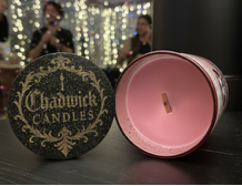 Chadwick Candles candle with decorative label on a dark surface
