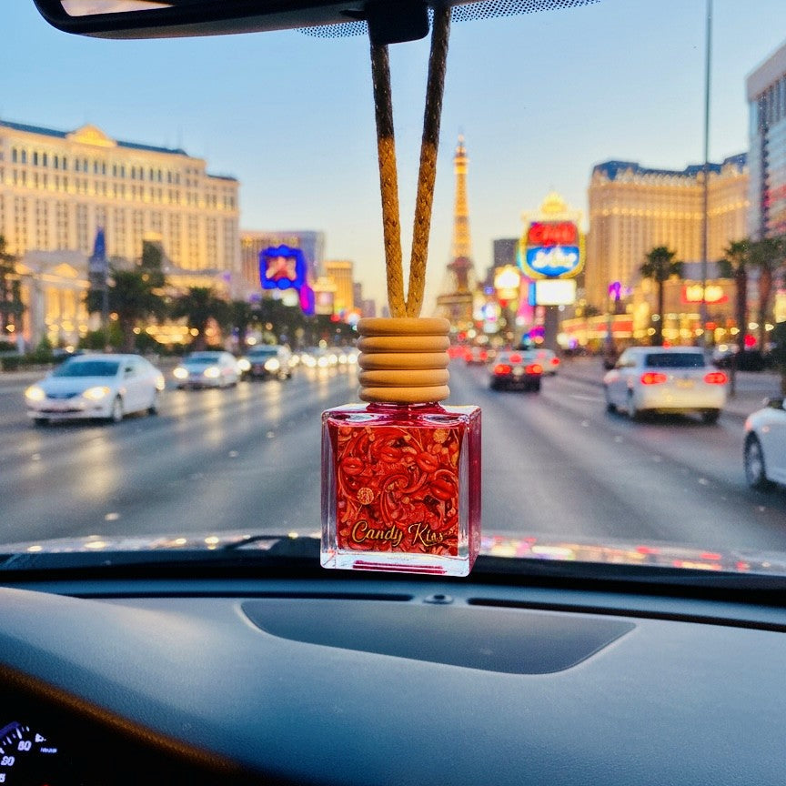 Car air freshener with a cityscape view from inside a vehicle