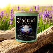 Chadwick Candles Mystic Meadows candle in a field of lavender with a wooden log.